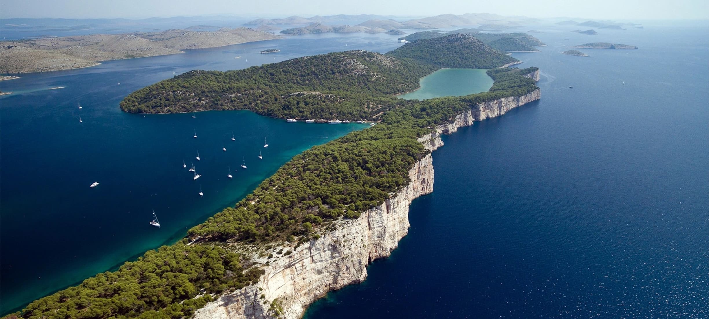 https://wp.boat4you.com/wp-content/uploads/2024/06/Plan-Your-Perfect-Sailing-Route-North-Dalmatia-Heading.webp