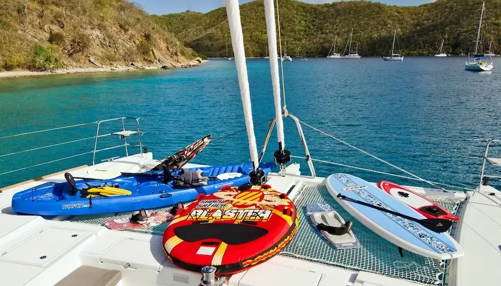 Yacht charter group enjoying water toys and entertainment on the swim platform