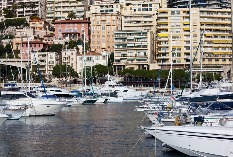 Cannes-style harbour with moored yachts