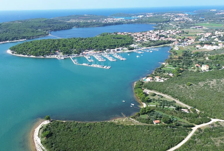 Aerial of Marina Pomer pontoons in sheltered Medulin bay, Istria, Croatia