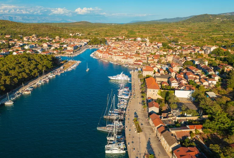 Aerial of Stari Grad on Hvar with yachts moored along the old town quay
