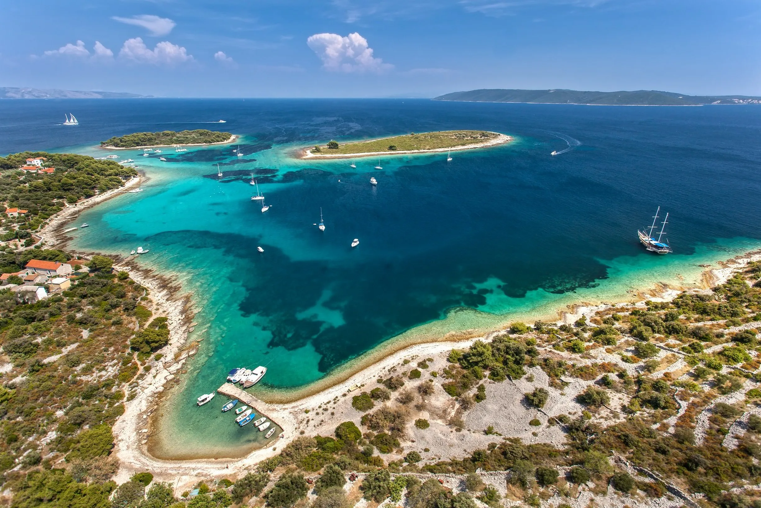 https://www.boat4you.com/wp-content/uploads/2026/06/boats-anchored-in-the-turquoise-blue-lagoon-at-krknjasi-near-2449.webp