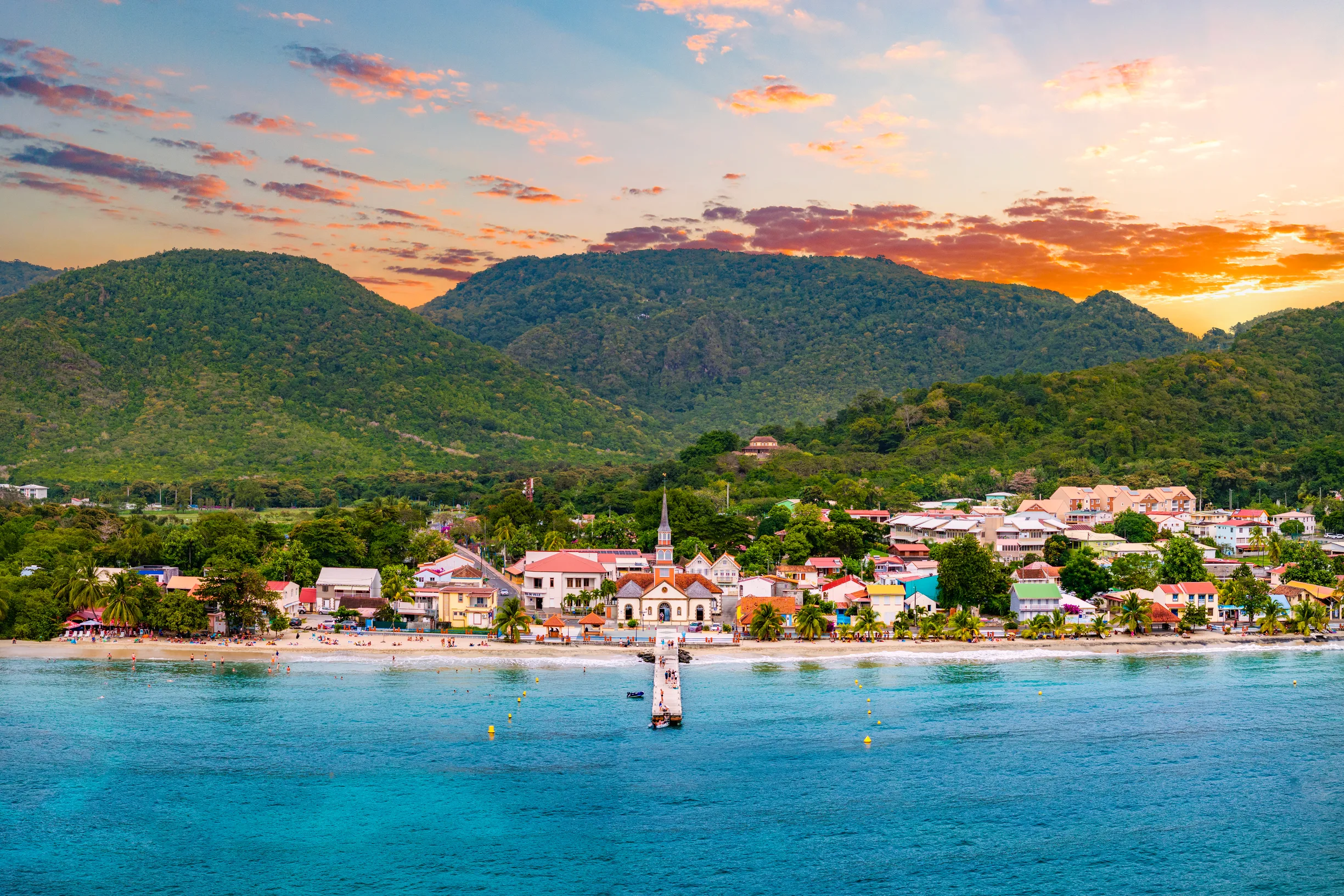 Anses-d'Arlet village beach and church spire at sunset, Martinique