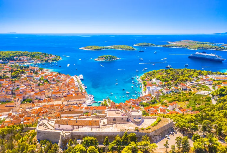 Hvar town, its Spanish fortress walls and the Pakleni Islands seen from above