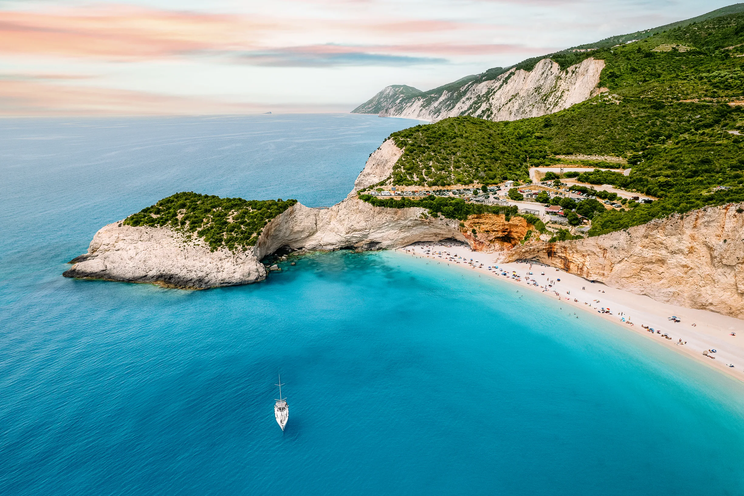 https://www.boat4you.com/wp-content/uploads/2026/06/lone-sailboat-at-sunset-beneath-the-porto-katsiki-cliffs-in-2449.webp