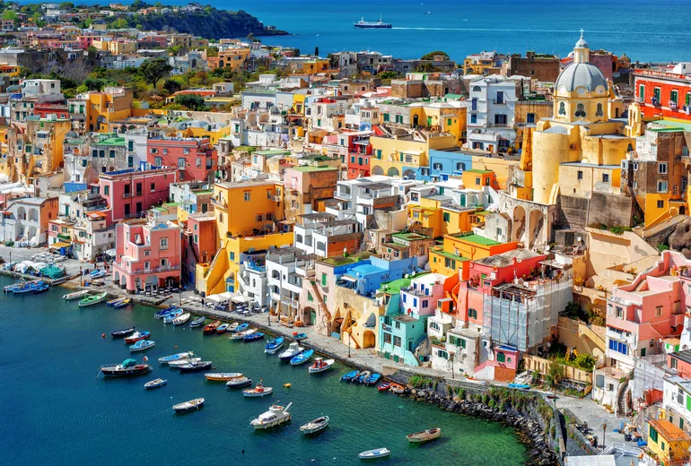 Pastel houses above Marina Corricella harbour on Procida island